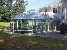 A pool dome enclosure with triangular shapes. 2021 Pool Enclosure Cost Screened In Pool Prices Pool Screen Enclosure Cost