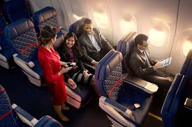 The Tricky Business Of Selling Alcohol On Planes A Delta Air Lines Flight Attendant Offers Wine Abroad A Boeing 737 900er Delta Comfort Delta Delta Airlines
