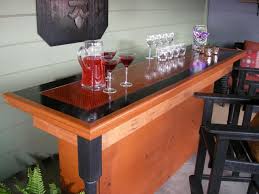 But sometimes those spaces can be turned into a relaxing retreat for friends and family. Build A Bar Using A Reclaimed Door For The Top Hgtv