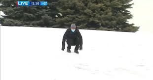 A division of kpi media group © 2011. Video Weather Reporter Continues His Forecast While Sliding Downhill On Snow
