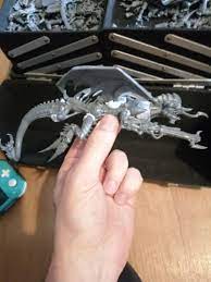I'd like a harpy, but i have no money. I do have spare tyranid parts, some  wings, some blu tack to practice and some green stuffputty.... I now have  the ugliest, most
