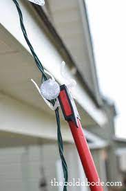 He installs a gfci to secure the lights to the roofline, heath used universal shingle/gutter light clips, which can be found at the home depot. How To Hang Christmas Lights Without A Ladder