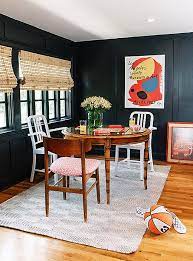 In the example above, a pair of slipcovered armchairs anchor the ends of the table. How To Master The Mismatched Dining Chair Trend