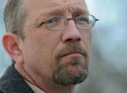 Ex-priest off to prison with a grin