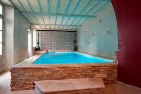 These 8 photos prove you can swim all year round. Indoor Swimming Pool Piscine Interieure Le Mans Piscines Carre Bleu Above Ground Concrete Stone