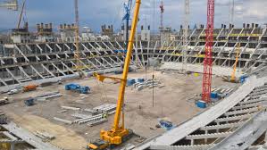 The puskás arena is located in an area that is a mix of other sports facilities, offices, residential buildings, and some retail. A Puskas Ferenc Stadion Rekonstrukcioja Az Eloregyartott Vasbeton Szerkezetek Szemszogebol 2018 Oktober Xxvi Evfolyam V Szam Betonujsag A Beton C Szakmai Lap Hivatalos Honlapja
