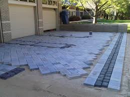 If you want to add some interest to your patio, use different colored pavers to form a design or pattern. Paver Installation Landscaping Network