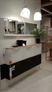 A Chic Black And White Ikea Trones Cabinet With A Wooden Tabletop As A Floating Entryway Console Ikea Entryway Ikea Ikea Shoe