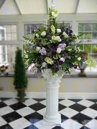The doorway is another area that can be dressed either with an archway, pedestal or topiary trees either side. Pedestal Arrangements Wedding Flowers
