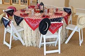 Simple, easy table decor for western/cowboy themed party. Need Some Ideas For Planning A Wild West Part Y Decorate Using Cow Print Patterned Fabric Wild West Party Cowboy Party Decorations Cowboy Theme Party