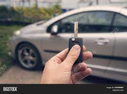The technology in modern cars has turned driving into a fun experience. Man Holds Auto Key Image Photo Free Trial Bigstock
