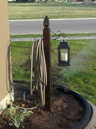 10 Most Inspirational Hose Caddy Design Ideas For Your Garden Front Yard Landscaping Yard Landscaping Backyard Landscaping