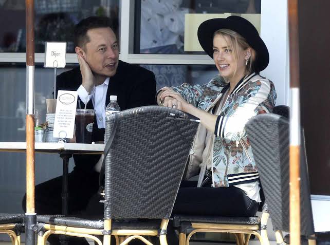 Amber Heard Looked Completely at Ease as She Boarded Elon Musk’s Private Jet With His Sons—But the Quiet Airport Moment Said More Than Anyone Expected