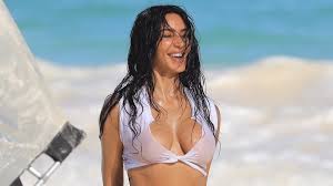 Kim Kardashian wows in a busty bikini as she takes a splash for playful  beach photo shoot in Los Angeles | Daily Mail Online