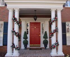 Decorated columns and windows adorned with holiday wreaths are all that is needed to create a most appealing christmas porch! Decorate Your Porch For Christmas Between Naps On The Porch