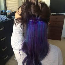 Purple hair with black shimmer looks luxurious with long curls. Get Crazy Creative With These 50 Peekaboo Highlights Ideas Hair Motive Hair Motive