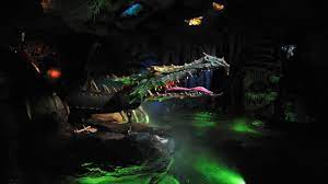Once the ruler of the skies, this defeated dragon lies chained against jagged rocks. Behind The Camera Into The Dragon S Den At Disneyland Paris Mickeyblog Com