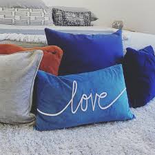 Pick a theme our outdoor decorative pillows come in a wide array of shapes and patterns to perfectly complement your outdoor and patio decor , including your outdoor rugs. Blue And White Throw Pillows On Gray Couch Photo Free Blue Image On Unsplash