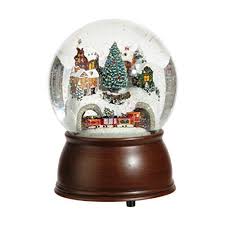 From the legendary lionel trains, this charming snow globe depicts a golden train traveling through a mountain pass and across a brick bridge to reach a snowy peak near a pristine lake. 6 5 Inch Musical House And Moving Train Snowglobe Christmas Ornaments Top Brands Artists Designer Names Christmas Snow Globes Snow Globes Christmas Globes