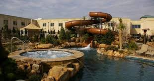 At The Choctaw Casino Resort In Durant Cool Off In Their Huge Pool And Enjoy A Cocktail From The Swim Up Bar For U Choctaw Casino Oklahoma Travel Resort Pools