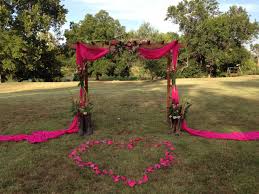 Wedding By The River Camo And Hot Pink Antlers On The Arbor Weddingreception Pink Camo Wedding Pink Wedding Decorations Camo Wedding Decorations