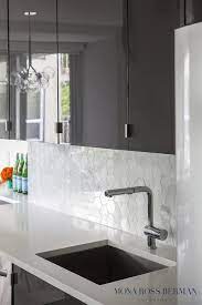 White kitchen cabinets and gray kitchen cabinets are the most popular to the customers. Dark Gray Kitchen Features Glossy Gray Lacquer Flat Front Cabinets Paired With White Quartz Countert Grey Cabinets Glossy Kitchen Backsplash With Dark Cabinets