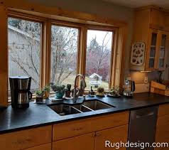 Add bright shades of yellow to your kitchen wall and surrounding and it will blend perfectly with the golden tones of the cabinetry. The Best Wall Colors To Update Stained Cabinets Rugh Design