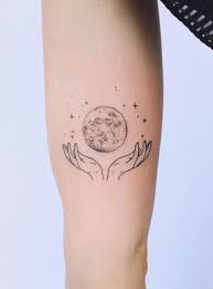 Hands And Moon Back Of Arm Tattoo Arm Hands Moon Tattoo Actualtattoos Back Of Arm Tattoo Planet Tattoos Hand Tattoos