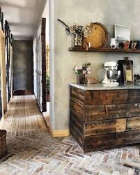 This chic and polished kitchen is full of stunning woodwork, both in the floors and cabinets. 6 Brick Kitchen Floor Ideas We Re Currently Obsessing Over Hunker Brick Floor Kitchen Dark Wood Kitchens Brick Kitchen