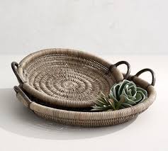It's handmade from rattan with a tight weave in a natural white wood hue for a. Round Woven Decorative Tray With Handles Pottery Barn
