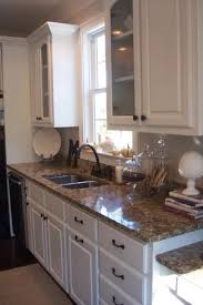 It never needs replacing as it will retain its original look for a lifetime. Santa Cecilia Granite Traditional Kitchen