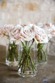 A Classic Blush Wedding With Lebanese Flair Belle The Magazine Flower Centerpieces Wedding Blush Wedding Centerpieces Pink Roses Wedding Centerpieces