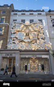 London, UK. 28th Nov, 2023. Businesses in New Bond Street decorate  frontages with lavish festive season displays for Christmas 2023. Dior and  Chanel shops drape the facades with monumental ornaments. Credit: Malcolm