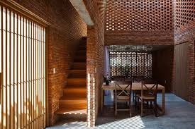 Passively Cooled Termitary House In Vietnam Is Wrapped In Perforated Brick Walls Brick Architecture Architecture Brick Facade