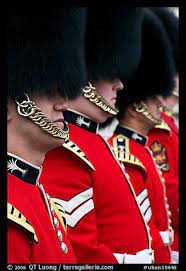 Guards With Tall Bearskin Hat And Red Tunic Standing In A Row London England United Kingdom Red Tunic London Guard