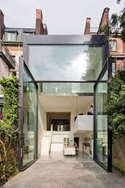 Porte Fenetre Geante Sur Pivot Deporte Triplex Design A Anvers Maison D Architecture Maison Moderne Maison De Ville