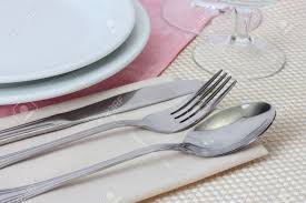Place the knife to the right of the dinner plate, blade facing toward the plate. Table Setting With Fork Spoon Knife Plates And Napkin Stock Photo Picture And Royalty Free Image Image 14708080