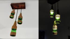 Once you have all of your supplies, clean your bottles, let them dry, and fill them 2/3 of the way full with oil. 18 Homemade Beer Bottle Chandelier Ideas You Can Diy Easily