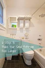 Try these tips to make your small bath look much bigger. 6 Ways To Make Your Small Bathroom Feel Larger Small Bathroom Bathroom Remodel Cost Top Bathroom Design