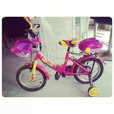 for sale baby girl bicycle pink color price 10 bd للبيع سيكل اطفال بناتي لون وردي بحالة ممتازة السعر 10 bd tel 33770050 moped motorcycle vehicles