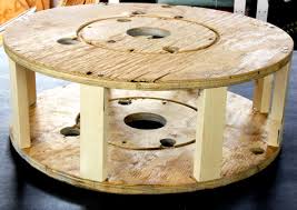 An old footlocker is the perfect size and shape for making an ottoman. Diy Project Shelly S Salvaged Spool Ottoman Design Sponge