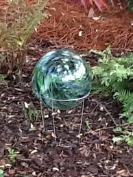 Green mosaic gazing ball $60.00. Repurposed Tomatoe Cage To Stand For Gazing Ball Gazing Ball Tomato Cages Garden Balls