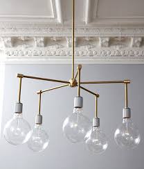 10 Awesome Diy Brass Light Fixtures A Beautiful Mess Brass Chandelier Diy Diy Chandelier Modern Brass Chandelier
