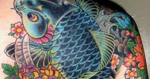 Koi tattoo designs are often combined with splashing water, cherry blossom and lotus flowers. The Coolest Koi Fish Tattoo Designs You Have Seen