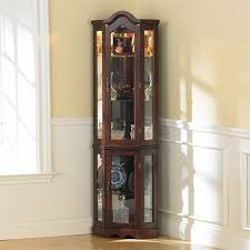 The rich mahogany finish adds to the elegance of the cabinet and the lighted interior helps to display all your valuable collectibles in the best light. Pemberly Row Mahogany Lighted Corner Curio Cabinet Walmart Com Walmart Com