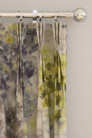 Velvet curtains in a range of green, grey, blue and black infuse an effortless luxe feel into your home. Fiore Curtains By Clarke Clarke Charcoal Chartreuse Fabric Wallpaper Direct