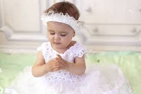 The articles include black and white diagrams of beautiful princesses in their long gowns. Baby Girl In White Dress Taking A Beautiful Single White Flower Stock Photo Picture And Royalty Free Image Image 128807072