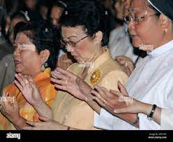 Former Philippine President Corazon Aquino, center, resigned Social Welfare  Secretary Corazon 