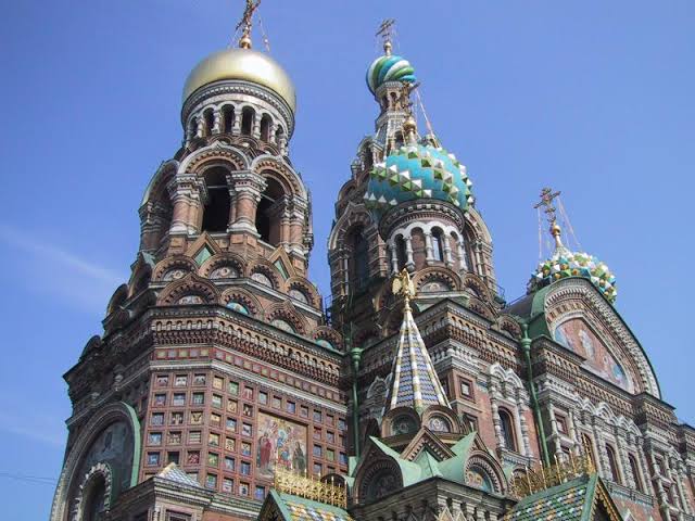Image result for Detail of the richly decorated façade and onion domes"