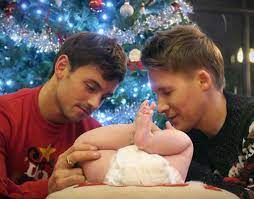 Another photo has surfaced online, courtesy of !! Dustin Lance Black Slams Homophobic Press Over Christmas Baby Photo